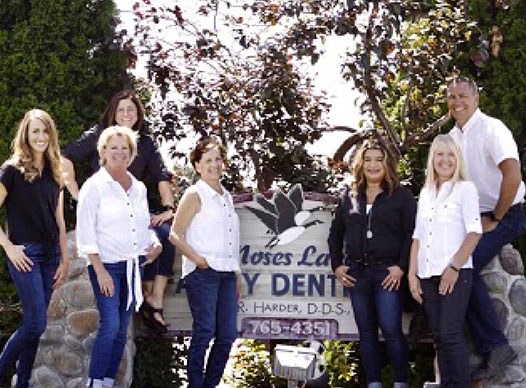Moses Lake Family Dentistry team smiling by sign