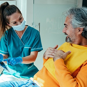 a patient speaking with a dental hygienist