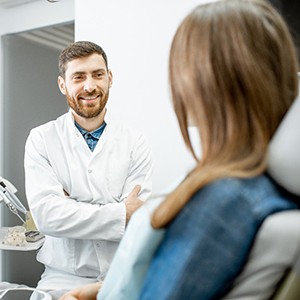 a patient talking with their dentist