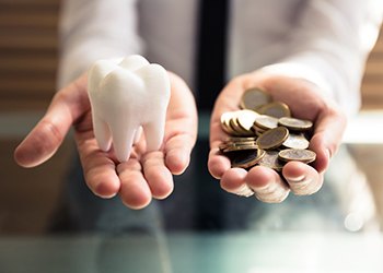 person holding tooth and money in Moses Lake