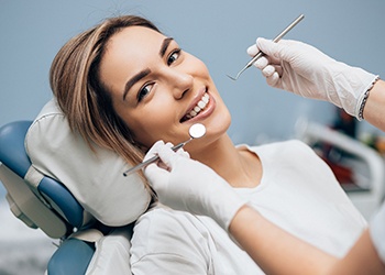 Woman smiling during her initial consultation