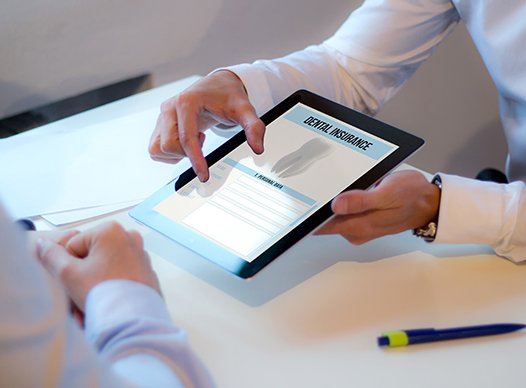 dental insurance paperwork on tablet