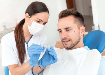 Man at dentist to get Invisalign in Moses Lake