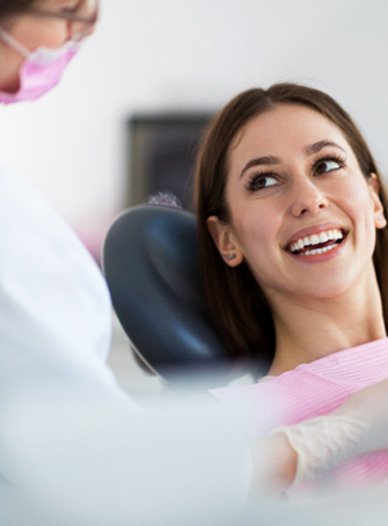 patient smiling while visiting dentist in Moses Lake