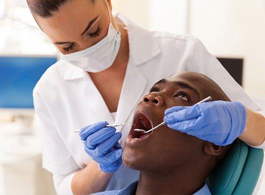 man getting dental cleaning