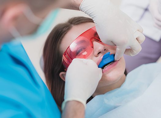 girl getting fluoride treatment