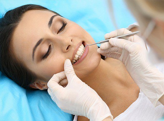 woman having periodontal therapy done