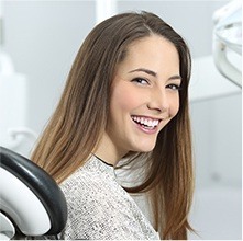 woman laughing in exam chair