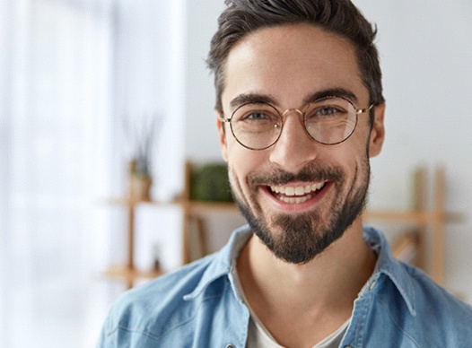 Smiling man with healthy smile and tooth-colored fillings in Moses Lake