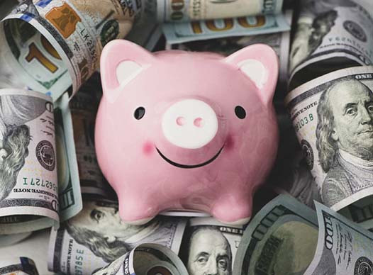 Piggy bank and cash for veneers in Moses Lake