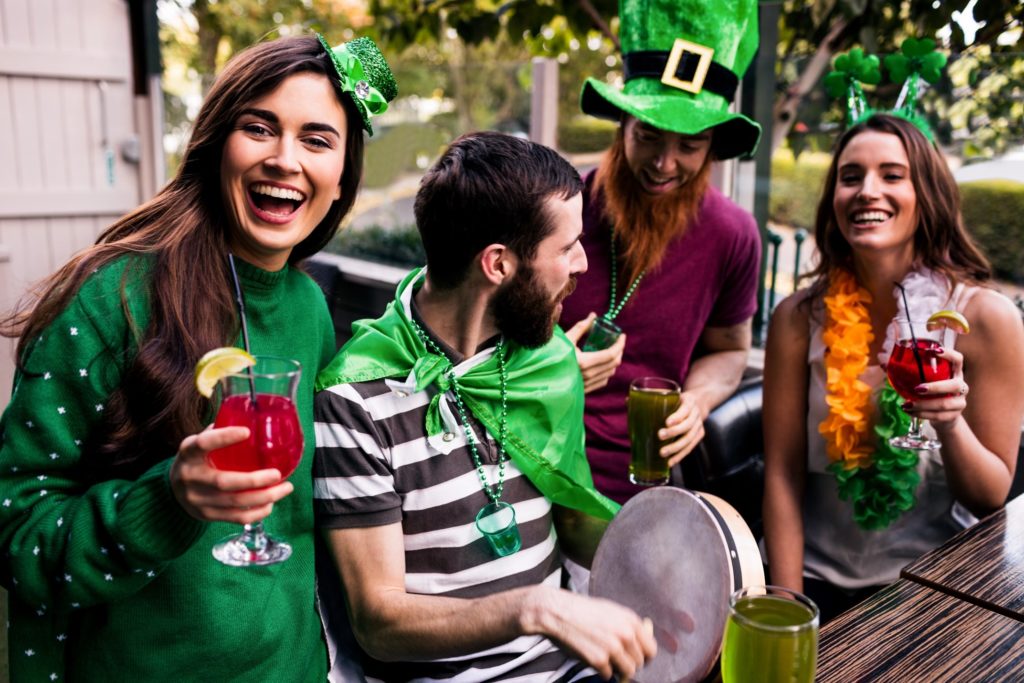 Friends celebrating St. Patrick's Day together at a bar