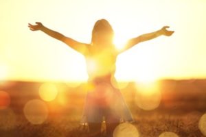 A person enjoying the sun’s rays to increase their vitamin D intake.