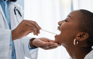 Woman having mouth examined by dentist. 