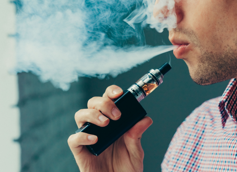Close up of man vaping